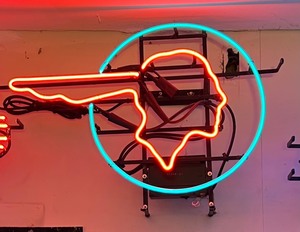 lot 15 image: Neon Pontiac Car Company Insignia Sign