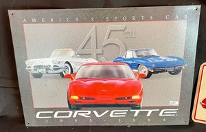 lot 63 image: Tin Corvette Signs