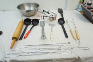 stainless steel bowl with kitchen utensils