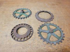 lot 418 image: Lot of (4) Antique Cast Iron Corn Planter Wheels - Largest is about 7 Diameter