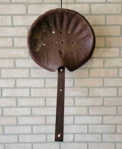 lot 535 image: Antique Stamped Steel Tractor Seat w Bar - NO SHIPPING