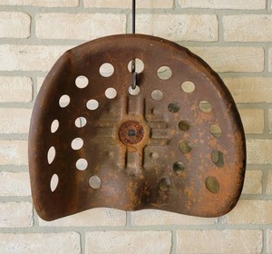 lot 536 image: Antique Stamped Steel Tractor Seat - NO SHIPPING