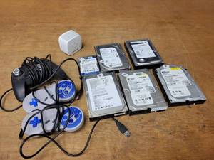lot 546 image: Lot of Computer Hard Drives and Game Controllers