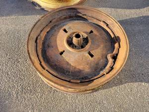 lot 180A image: Pair of John Deere A or B Rims w Cast Iron Centers - 9-38 - NO SHIPPING