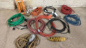 lot 40 image: All The Electrical Wires You Need-Assorted Large Extension Chords, Work Light and  More