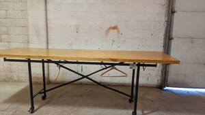 lot 64 image: Industrial 10ft Long 3.5 Tall Fine Wood Top Display Table with Metal base w Wheels