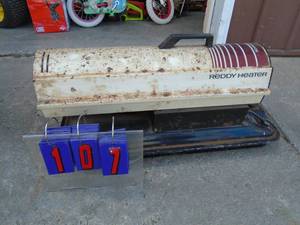 lot 107 image: Reddy heater. 50000 btu. Used condition. Fires right up. As shown.