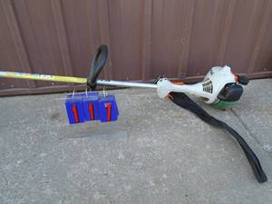 lot 117 image: Stihl fs46 2 cycle trimmer. Good used condition. Tested & works. As shown.