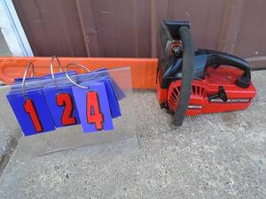 lot 124 image: Craftsman solid state chainsaw. Tested & works. needs carb cleaning, As shown.