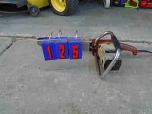 lot 125 image: Vintage Sears 110 volt chainsaw. Tested & works. As shown.
