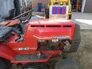 lot 126 image: Dynanark 1843 mower. Good used condition. B & S twin engine. Runs good  with 38 snow blower & mounting bracket. Appears complete. As shown.