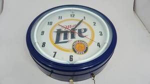 lot 10 image: Miller Lite-A True Pilsner Beer Electric Clock-1999 Miller Brewing Co.-20  x  20