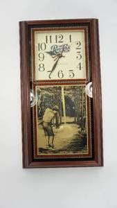 lot 15 image: Quartz Pendulum Framed Pepsi-Cola Battery Operated Clock With Golfer Picture On Bottom Half--13  x  24
