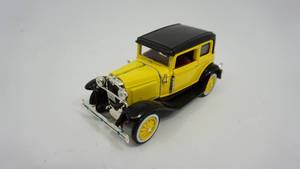 lot 37 image: Yellow & Black 1930 Model Crown Victoria--- 137 Die Cast