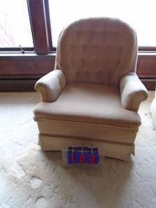 lot 102 image: Peach color fabric arm chair. No tears. Minor sun fading. As shown.