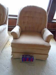 lot 103 image: Peach color fabric arm chair. No tears. Minor sun fading. As shown.