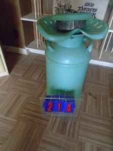 lot 214 image: Milk can with lid & tractor seat. As shown.