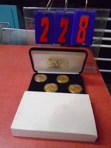 lot 228 image: Grand casino coins. As shown.