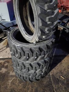 lot 17A image: NEW LSW 265-521NHS Skid Steer Tires Set of 4