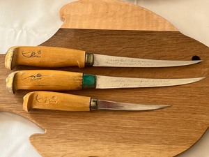 lot 22 image: Two Wooden Fish Shaped Cutting Boards & J. Martini Filet Knives
