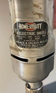 lot 64 image: Vintage Home Utility 14 Inch Electric Drill in Metal Case With Great Graphics