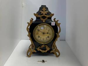 lot 5 image: Antique New Haven Clock Company Enameld Cast Iron Mantle Clock. ( With Key)