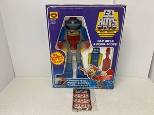 lot 44 image: Vintage Go Bots Mighty Robots Cap Rifle AND Scope in original box