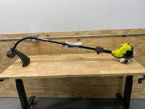 lot 99 image: RYOBI 25cc 2-Cycle Attachment Capable Full Crank Curved Shaft Gas String Trimmer