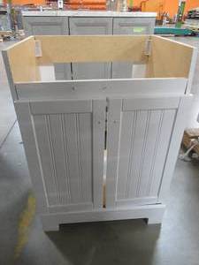 lot 230 image: Style Selections Ellenbee White Single Sink Vanity Cabinet 24-in x 19-in, C21124-SS - Scratch and Dent, Broken Top Cross Bar, Cracked RH Side Panel..