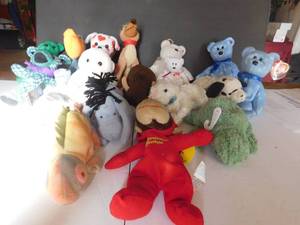 19 Beanie Babies Including Curious George, Sesame street, and Eeyore