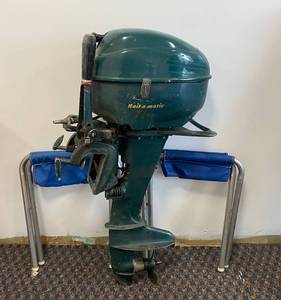 lot 61 image: Vintage Bail-a- Matic 7 12 Horse Outboard Motor and vintage folding chairs.