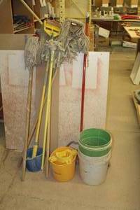 lot 648 image: Cleaning Supplies - Mops (x4), Push Broom, 5-Gallon Buckets (x2), 2-Gallon Buckets (x2)
