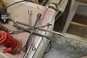 lot 73 image: Lot of (3) 4-Way Tire Irons