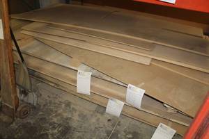 lot 570 image: Stacked Lumber - Oak Veneer, MDF, Baltic Birch, Particle Board, Black Melamine