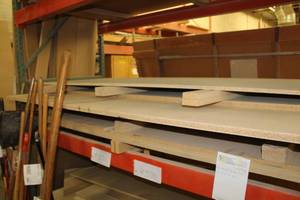 lot 571 image: Stacked Lumber - Black Melamine, MDF, Particle Board