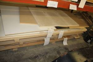 lot 577 image: Stacked Lumber - Maple Plywood, Black Melamine, White Melamine, MDF, Plywood