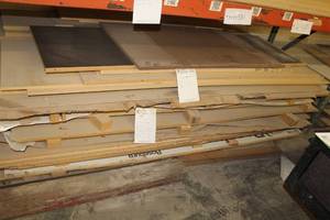 lot 580 image: Stacked Lumber - Apple Plywood, White Melamine, MDF, Particle Board, Almond Melamine, Plywood