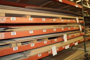 lot 581 image: Stacked Lumber - Masonite, Particle Board, MDF, OSB, Black Melamine, White Melamine, Oak Veneer, Maple Melamine