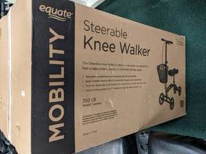 lot 50 image: New Steerable knee walker scooter....