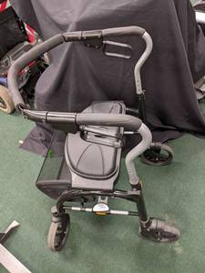 lot 62 image: Evolution foldable walker with carr...