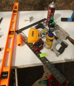 Lot of tools including a level and a square