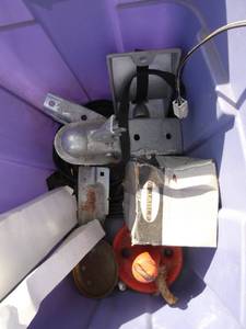 Tote of stuff including boat anchor, trailer receiver, funnel and more