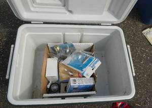 Coleman Cooler with a box full of light bulbs