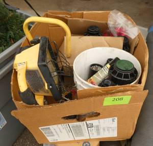 Box of sprinkler parts and a portable light