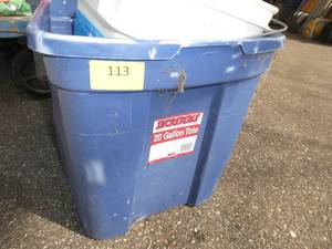 Tote of misc items including grass seed, fertilizer, spreader