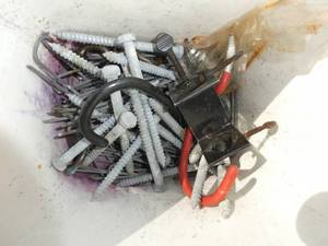 Bucket of electrical straps and big lag screws