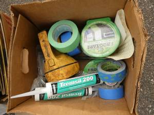 Box of frogtape, sealant, light