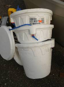 Box of misc toys and basketball hoop and minnow buckets
