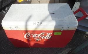 Coca Cola cooler (hinges are broken) and an Igloo Playmate cooler