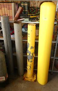 3 steel and 1 plastic bullard